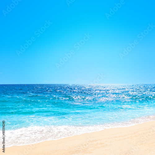 Fototapeta Naklejka Na Ścianę i Meble -  .Summer beach and soft wave background. Sand and sea. Tropical summer vacation concept with copyspace