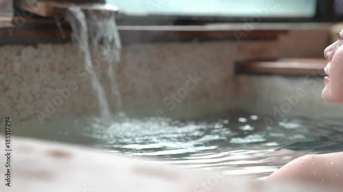 charming girl stay in hot spring water