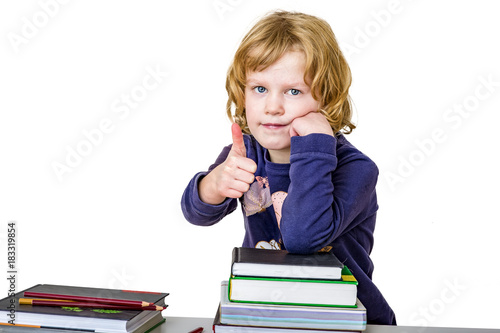 Girl with a stack of books and crayons photo