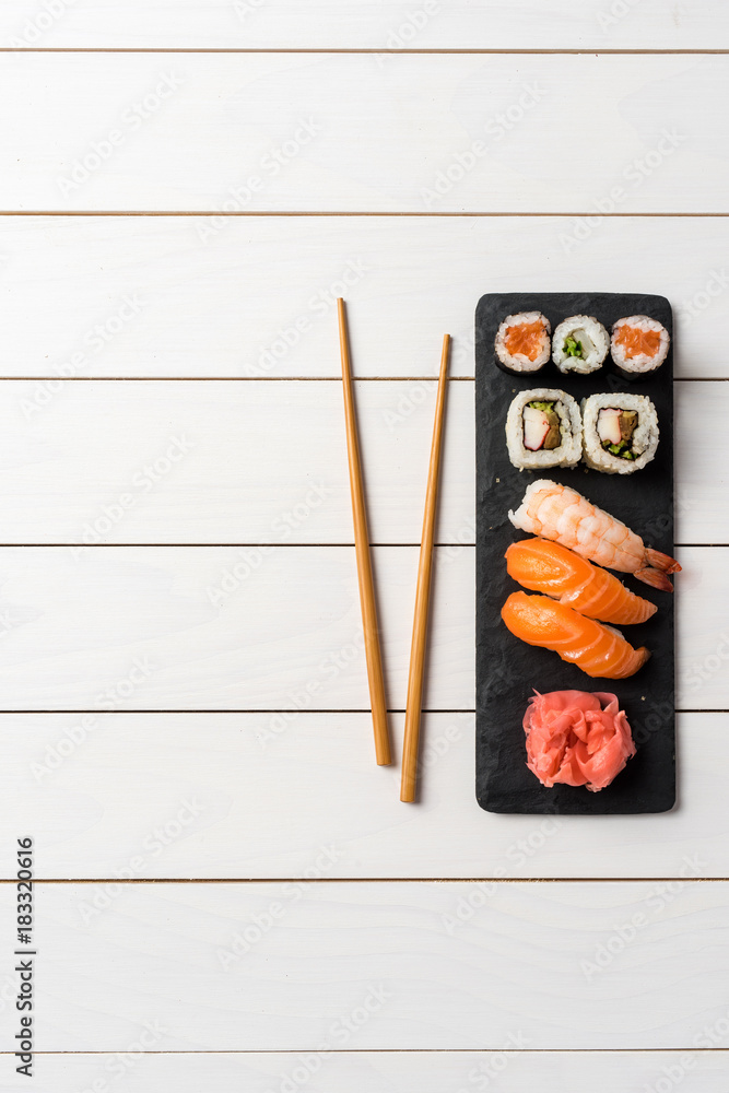 Set of Japanese sushi on white wooden table Set of Japanese sushi on white wooden table