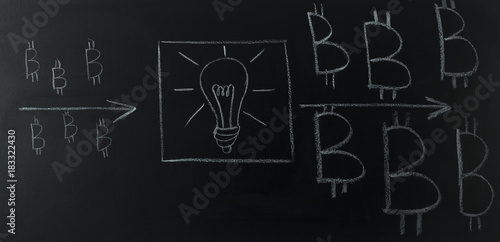drawn light bulb with logo bitcoin on blackboard