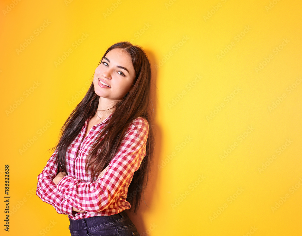 Fototapeta premium Beautiful smiling woman on color background