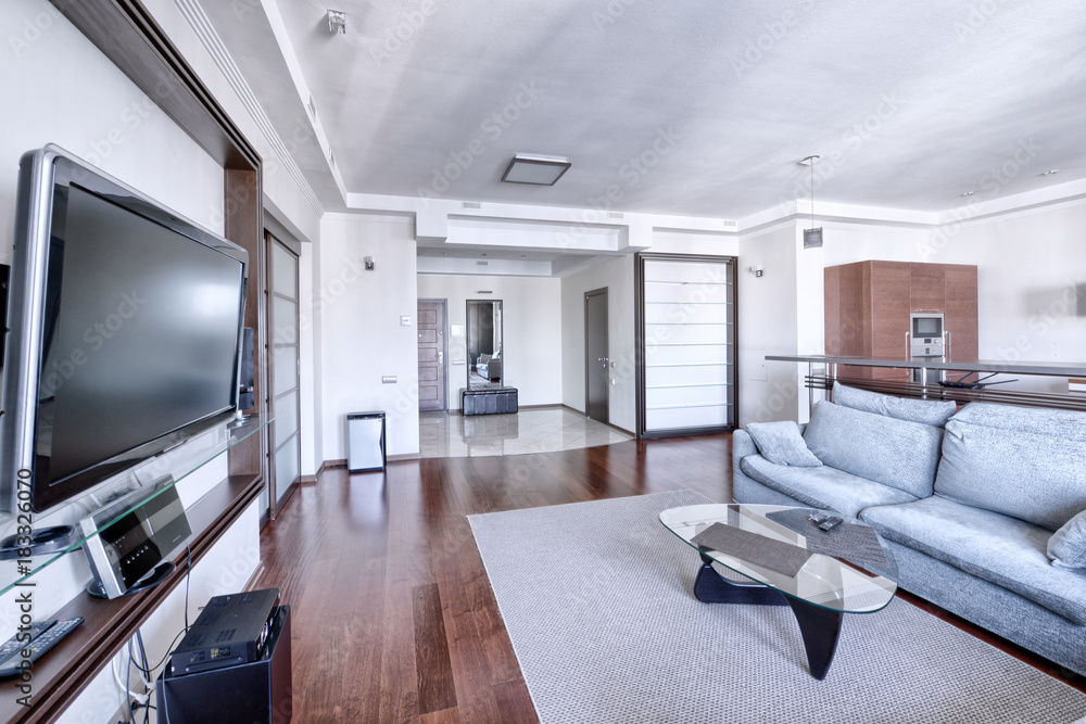 Interior of the kitchen-living room in a modern house.
Interior of the kitchen-living room in a modern house.