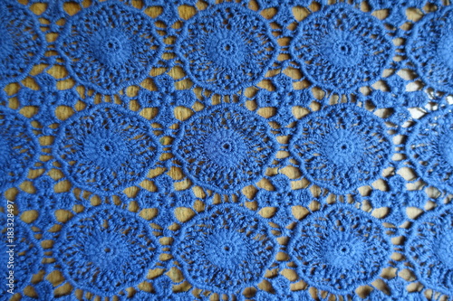 Rustic blue lacy fabric on wood from above