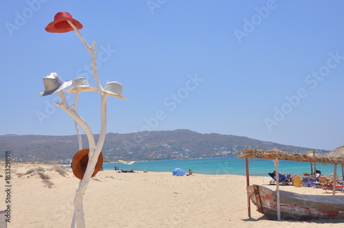 White decorative tree with hats in Naxos beach picture, Greece