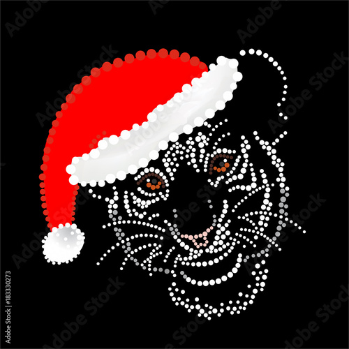 Fototapeta Naklejka Na Ścianę i Meble -  Tiger cub in a New Year's cap