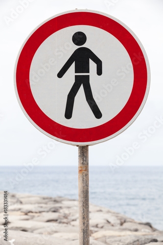Entry prohibited sign stands on a coast