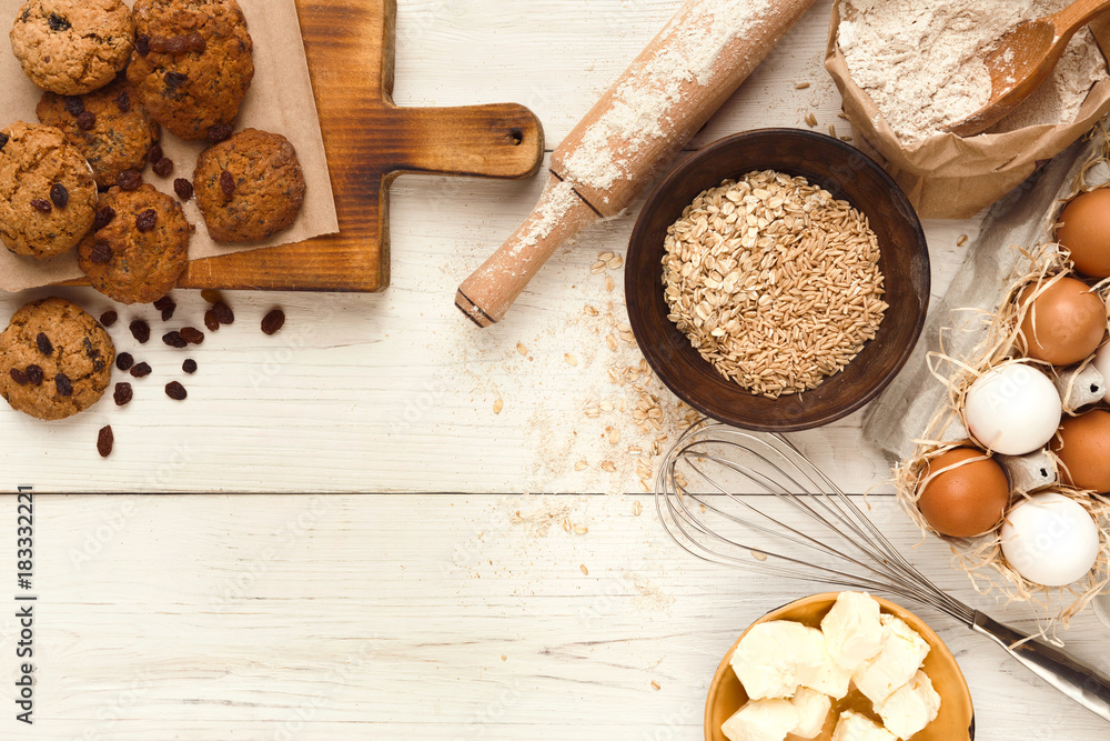 Oatmeal cookies and baking ingredients for homemade pastry background Oatmeal cookies and baking ingredients for homemade pastry background