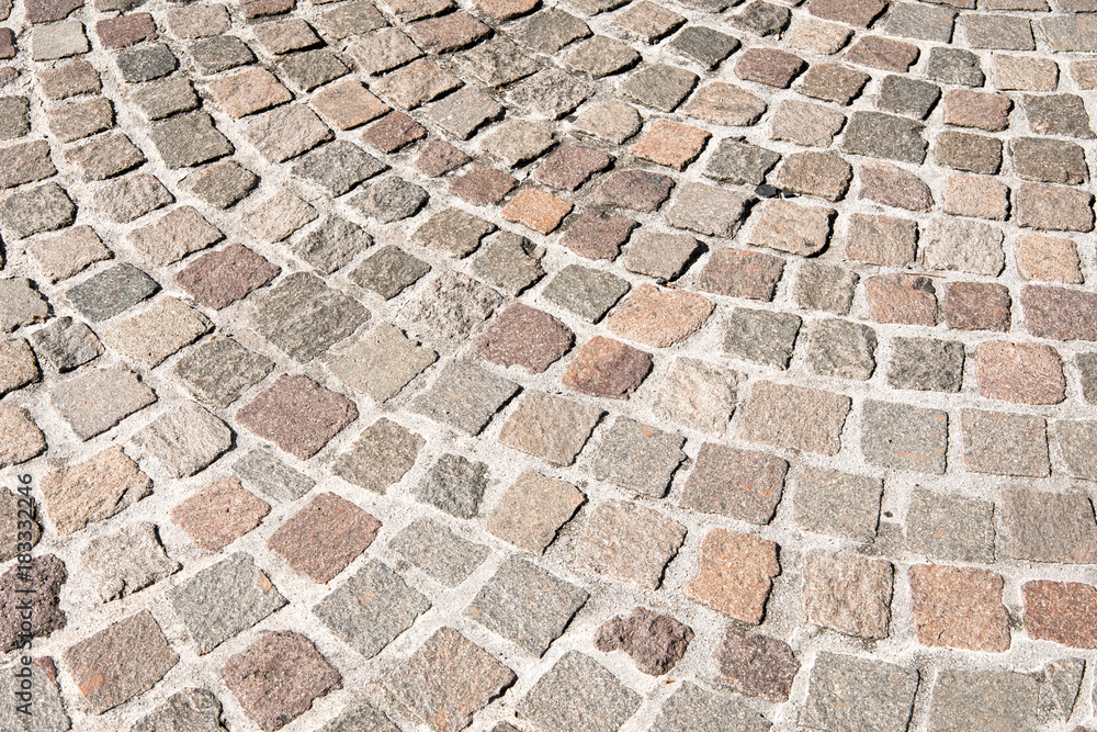 Vintage stone street road pavement texture, outdoor.