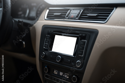 Car navigation system in modern car interior with mock up. Isolated display of multimedia. © Lalandrew