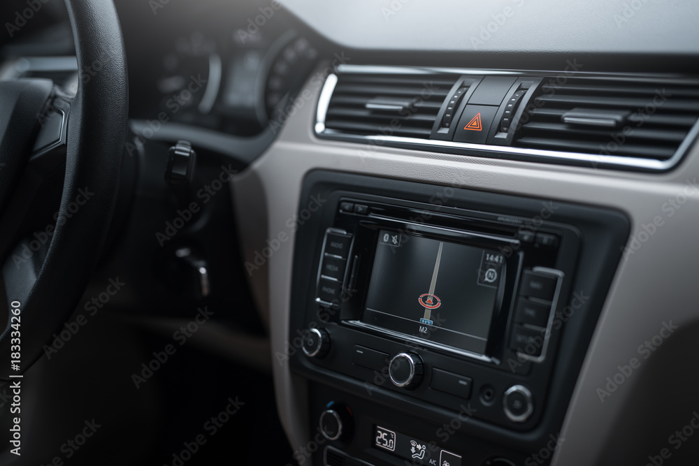 Car navigation system in modern car interior.
