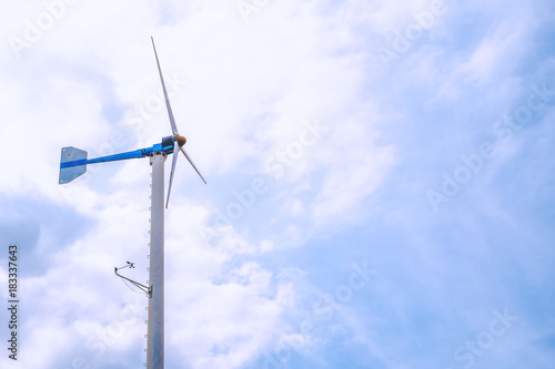 Wind turbines to produce electricity for renewable energy against clearly blue sky background © Kesinee