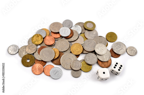 Coin stock images. 
Different coins on a white background. Different types of currencies. Money and dice