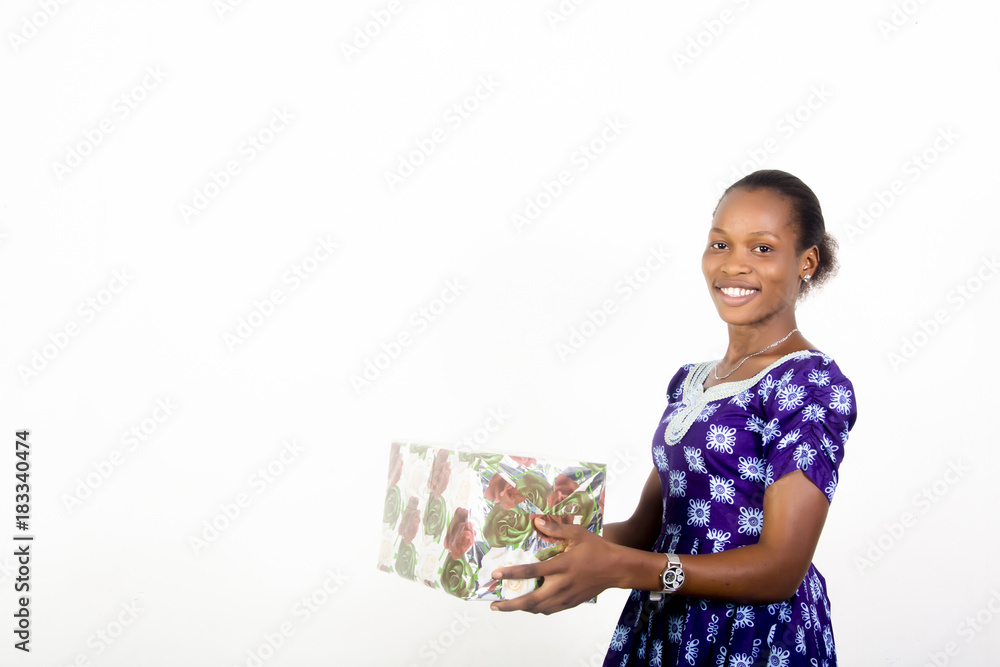 African American lady holding gift boxes in her hands African American lady holding gift boxes in her hands