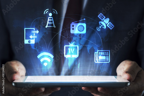 Media concept on tablet with hologram