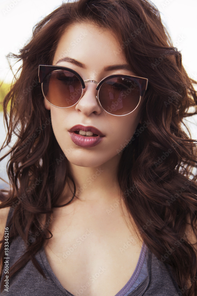Young beautiful brunette caucasian sexy adult woman outdoors in city, having fun skateboarding (on longboards). Summer weather Young beautiful brunette caucasian sexy adult woman outdoors in city, having fun skateboarding (on longboards). Summer weather
