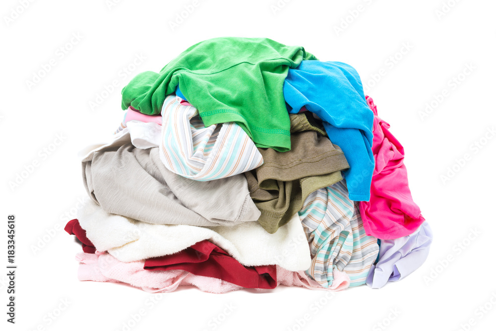 Big heap of colorful clothes isolated on white background Big heap of colorful clothes isolated on white background