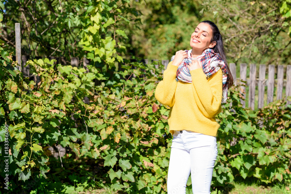 A beautiful woman enjoying the sunlight during Autumn A beautiful woman enjoying the sunlight during Autumn