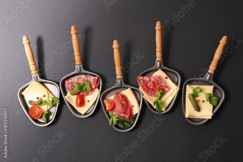 Photography assorted spoon of raclette cheese