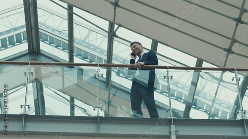 Wallpaper Mural Young businessman in suit indoors Torontodigital.ca