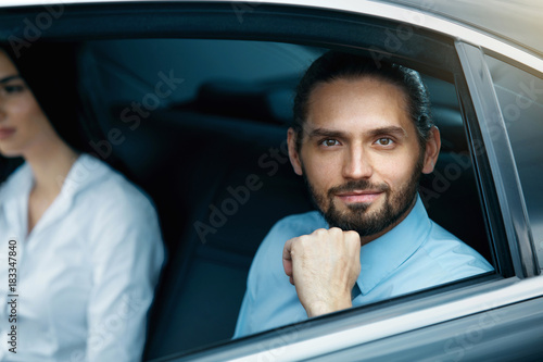Portrait Of Business People In Car.