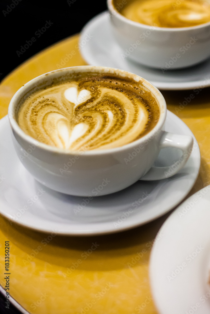 Double heart-shaped coffee art on espresso beverage Double heart-shaped coffee art on espresso beverage