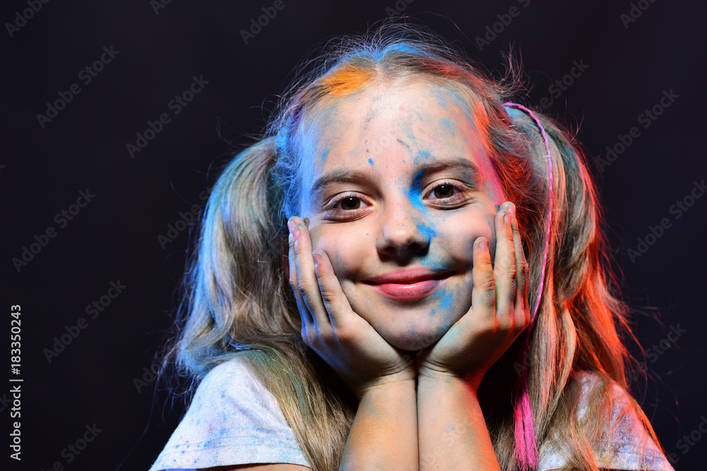 Kid with ponytails makes art. Girl with smiling face Kid with ponytails makes art. Girl with smiling face