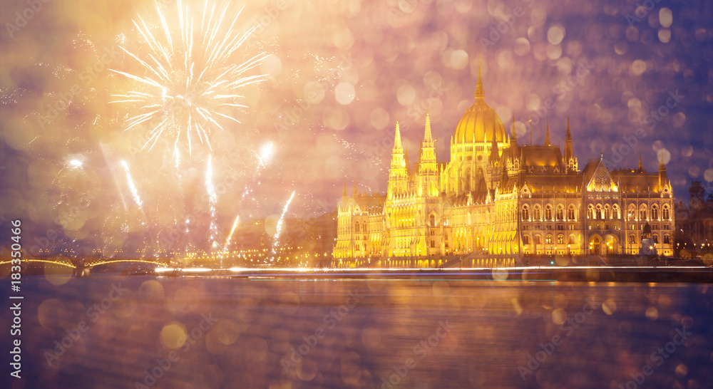 celebrating New Year in the city - Budapest parliament with fireworks, Hungary
