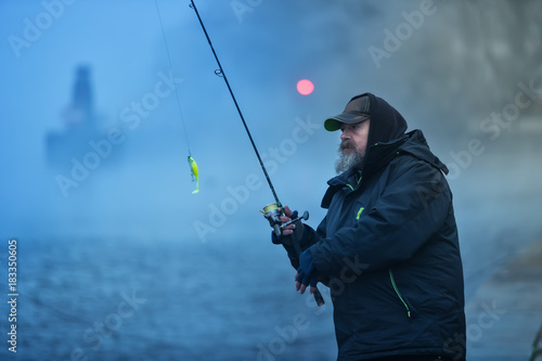 Alone fisherman, trying to catch fish in early morning © Jag_cz