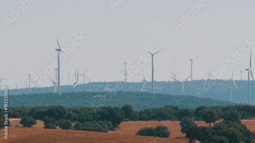 Windmill power technology, Green technology, a clean and renewable energy solution, Beautiful windmill turbines harnessing clean, green, wind energy in Spanish fields