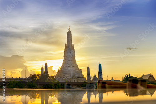 Sunset Wat Arun (Temple of Dawn) and Reflections of Wat Arun Pagoda on glass table is landmark of Attractions's Popular tourists, in bangkok Thailand © lukyeee_nuttawut