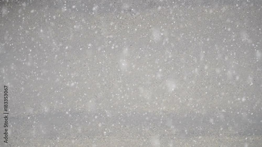 very rare natural phenomenon, snowfall in summer. slow motion of falling snow in the city very rare natural phenomenon, snowfall in summer. slow motion of falling snow in the city