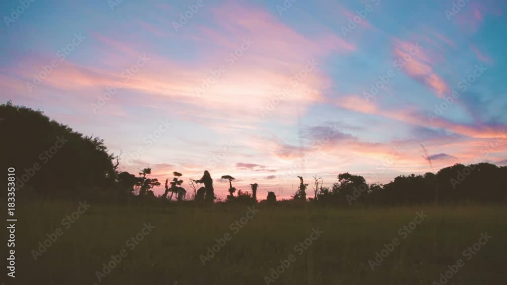 Gorgeous sunset cloudscape on Phuket island. Bottom view through grass. Thailand. Gorgeous sunset cloudscape on Phuket island. Bottom view through grass. Thailand.