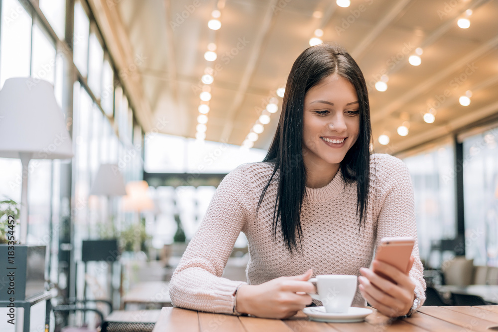 Young woman drinking coffee in a cafe,enjoying coffee break. Young woman drinking coffee in a cafe,enjoying coffee break.