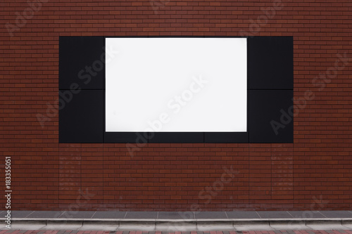 Fototapeta Naklejka Na Ścianę i Meble -  Large blank billboard on a street wall, banners with room to add your own text