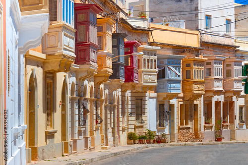 Fototapeta The traditional Maltese colorful wooden balconies in Sliema, Malta
