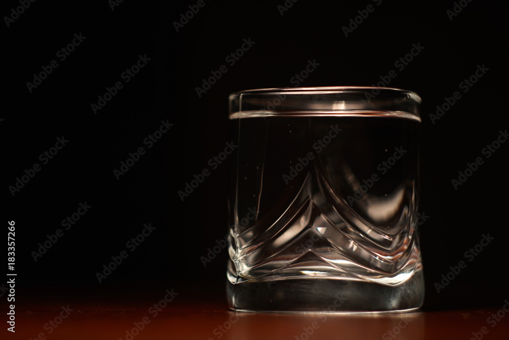 a glass of water on a black background a glass of water on a black background