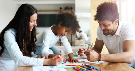 Happy family drawing and spending time together