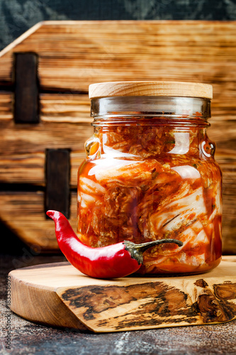 Cabbage kimchi glass jar. Korean traditional cuisine. Fermented food.