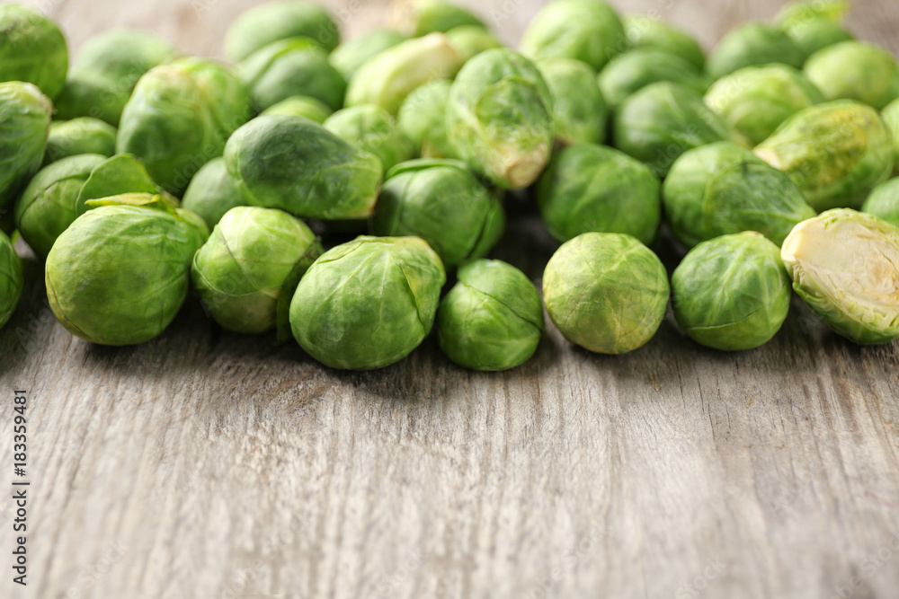 Raw Brussels sprouts on wooden table, closeup Raw Brussels sprouts on wooden table, closeup
