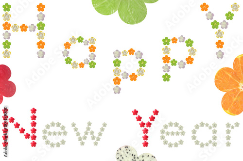 Happy New Year word from flower shaped fruit and vegetable on white background