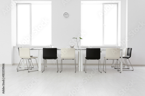 Modern office interior with large table and chairs © Africa Studio