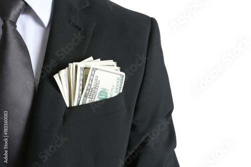 Fotografie Businessman with dollar bills in pocket on white background, closeup
