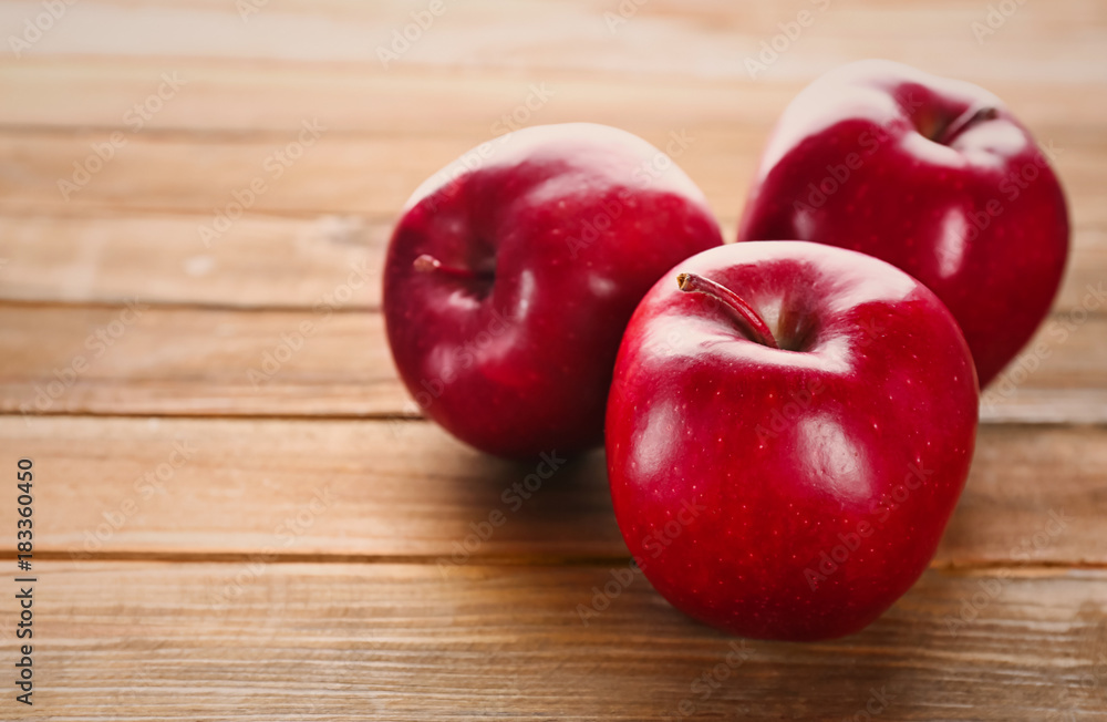 Ripe red apples on wooden background Ripe red apples on wooden background