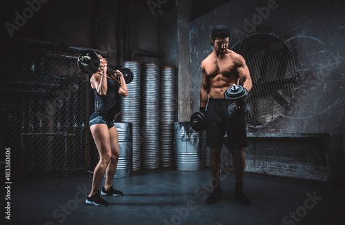 Young people making functional training in the grungy gym