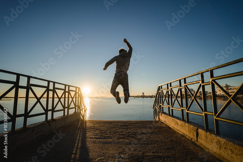 Man doing a workout at sunrise in Portugal