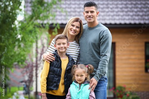 Happy family in courtyard n...