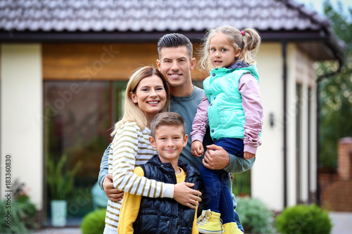 Happy family in courtyard n...