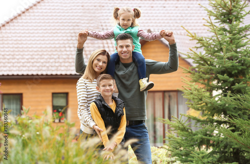 Happy family in courtyard n...