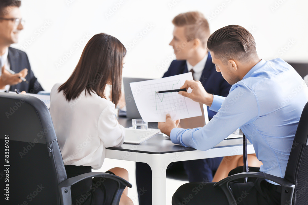 Team of young consulting experts on business meeting in office Team of young consulting experts on business meeting in office